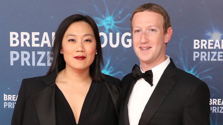 Mark Zuckerberg and Priscilla Chan attend an event