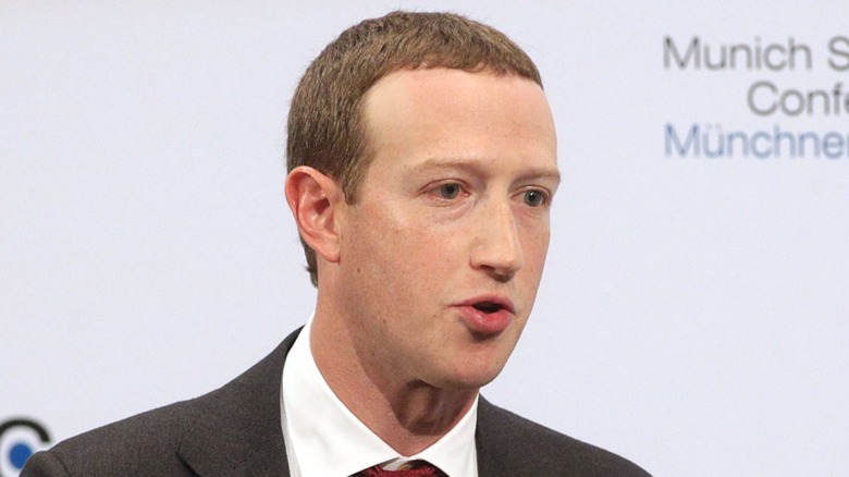 Mark Zuckerberg wears a burgundy tie