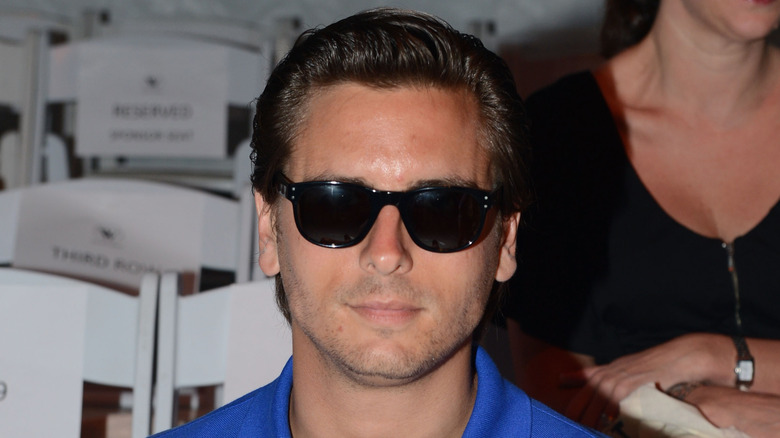 Scott Disick smiling with sunglasses on