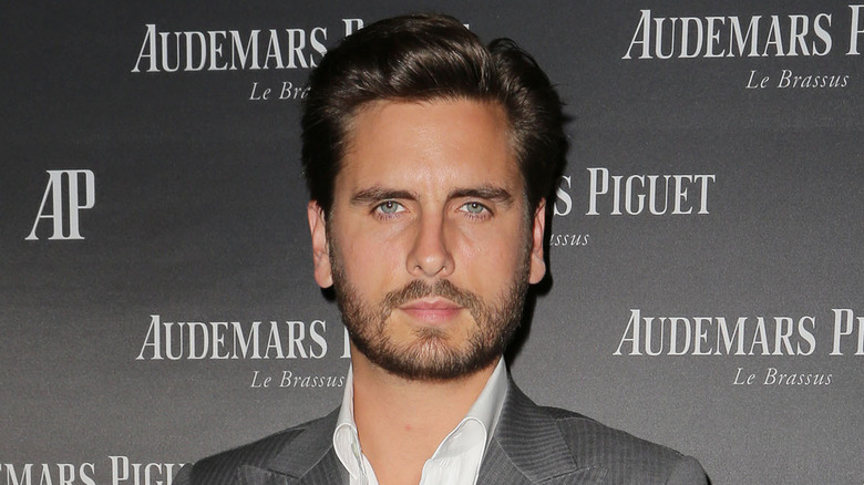 Scott Disick wearing a gray suit