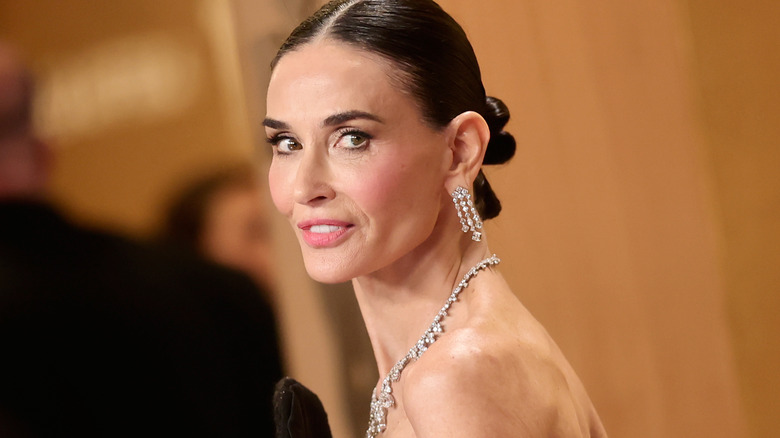 Demi Moore smiles on the red carpet