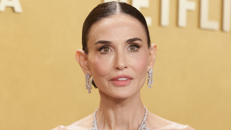 Actress Demi Moore poses on the red carpet