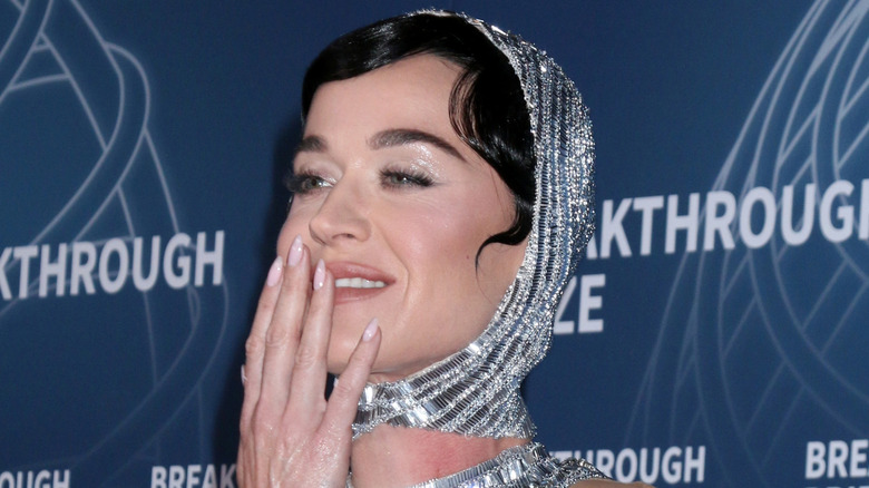 Pop star Katy Perry poses in headdress