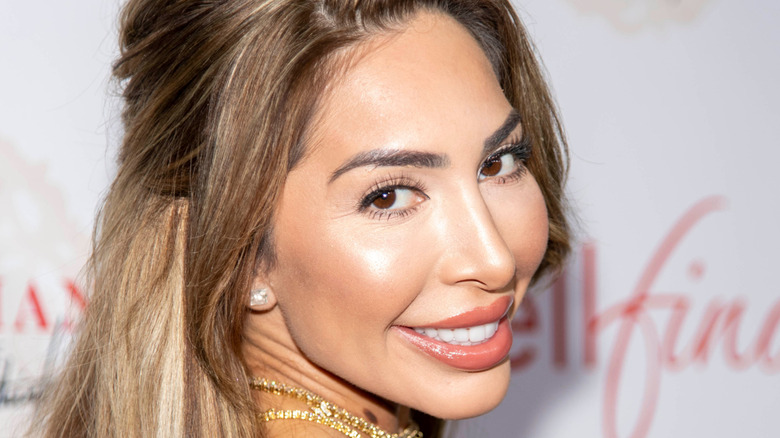 Teen mom star Farrah Abraham looking over her shoulder and smiling on the red carpet