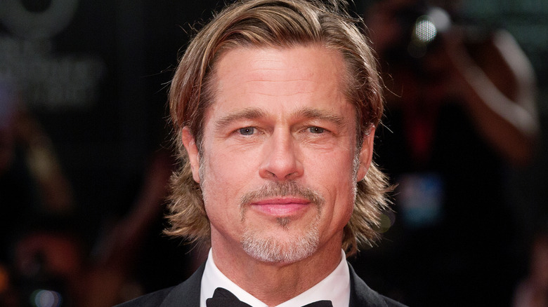 Brad Pitt with small smile 