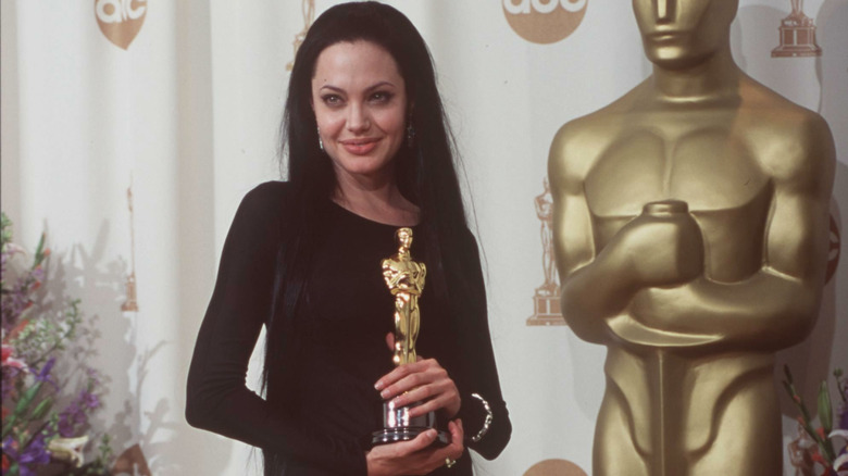 Angelina Jolie holding Oscar