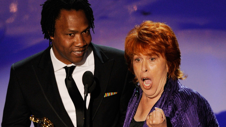 Roger Ross Williams and Elinor Burkett on stage