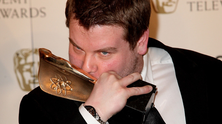 James Corden kissing his BAFTA award