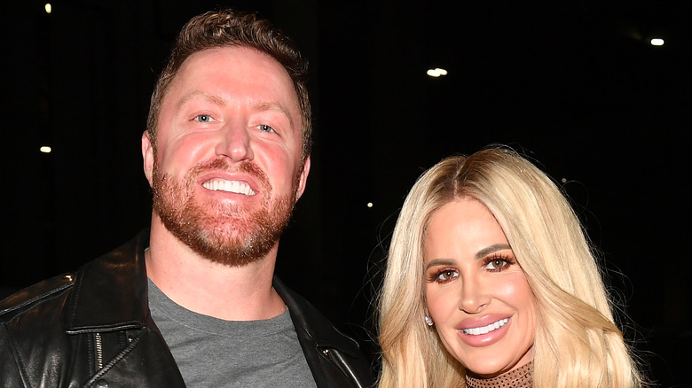 Kim Zolciak and Kroy Biermann smile outside