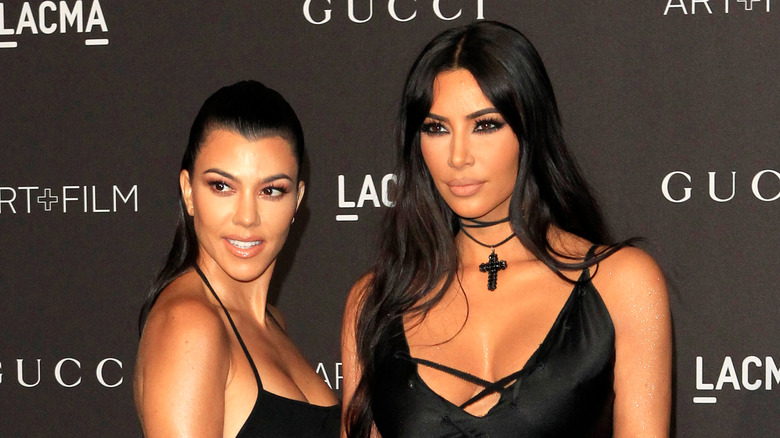 Kim and Kourtney Kardashian posing together