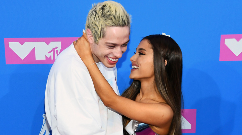 Pete Davidson and Ariana Grande laughing at the MTV VMAs