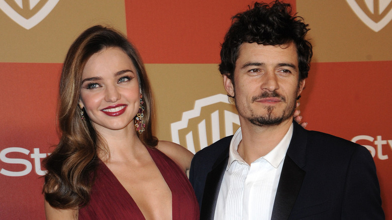 Miranda Kerr and Orlando Bloom posing together