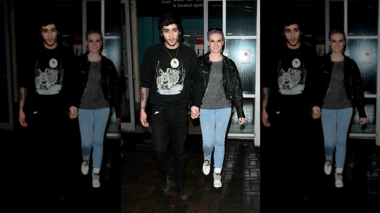 Zayn Malik and Perrie Edwards holding hands
