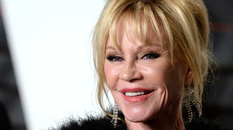 Melanie Griffith smiles for a photo in 2016
