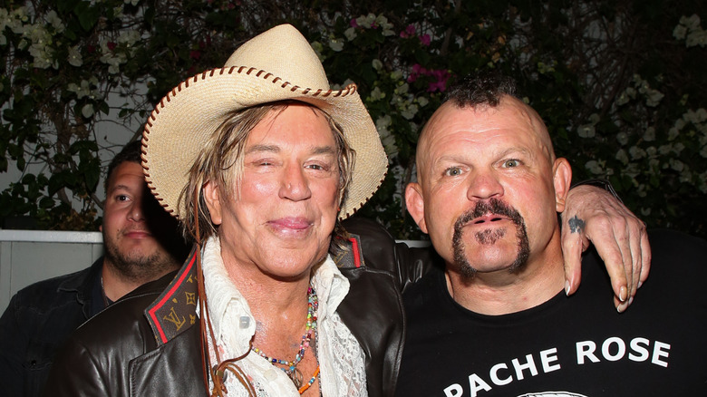 Mickey Rourke poses for a photo with UFC legend Chuck Liddell