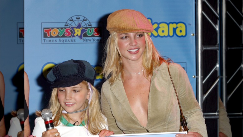 Jamie Lynn Spears and Britney Spears posing for photos at Jamie Lynn Spears Takes Center Stage with Hasbro's e-kara Real Karaoke PRO Headset at Toys "R" Us Times Square