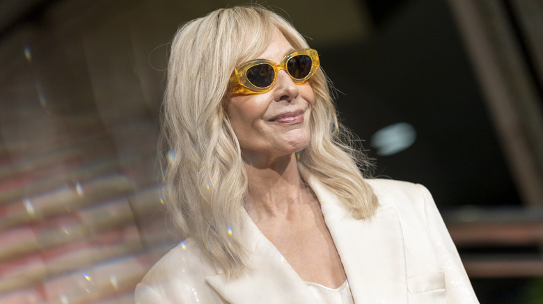 Allison Janney wearing yellow sunglasses