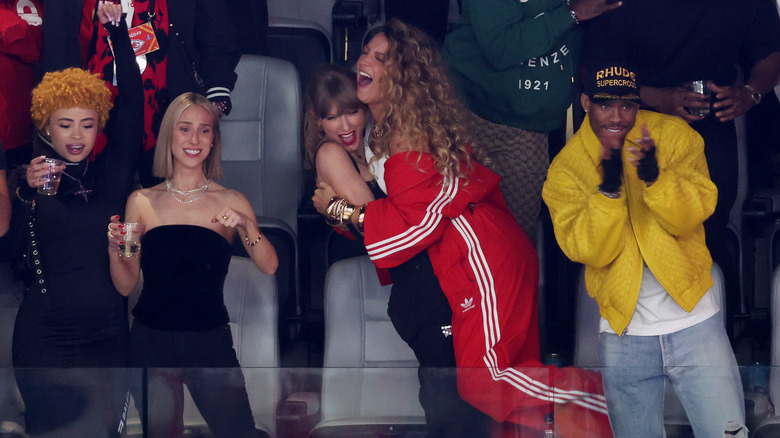 Taylor Swift and Blake Lively hugging at a Kansas City Chiefs game.