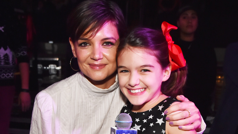 Katie Holmes and Suri Cruise at an event 