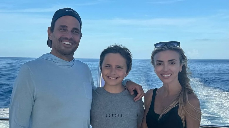 Bill and Giuliana Rancic pose with their son Duke on a boat.