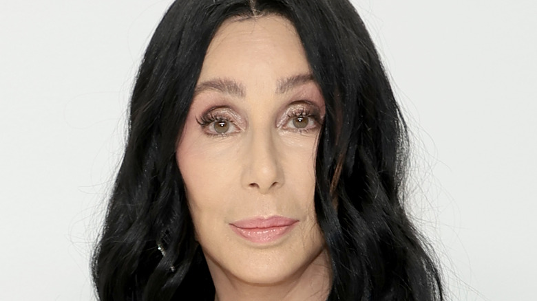 Cher posing at an event