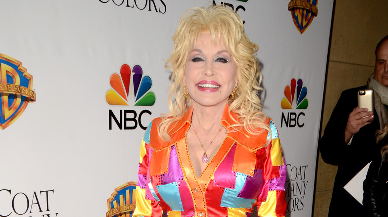 Dolly Parton smiling on the red carpet