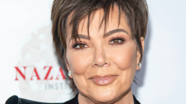 Kris Jenner piecey bangs neutral lipgloss