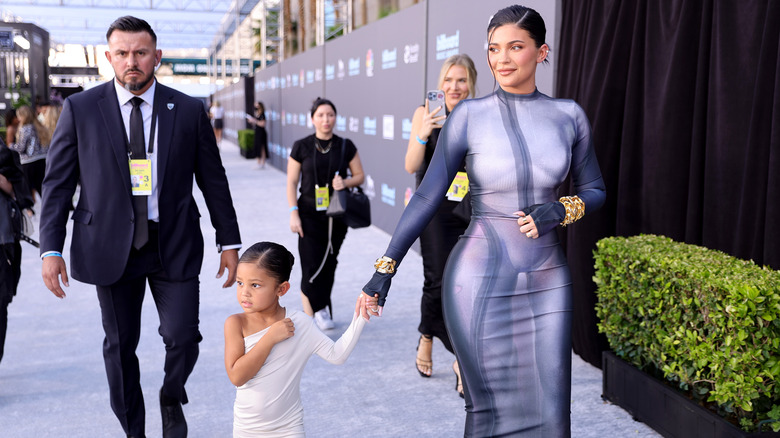 Kylie Jenner holds hands with her daughter Stormi in 2022