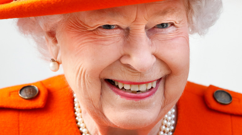 Queen Elizabeth grinning big