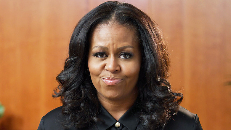 Michelle Obama slightly smiling