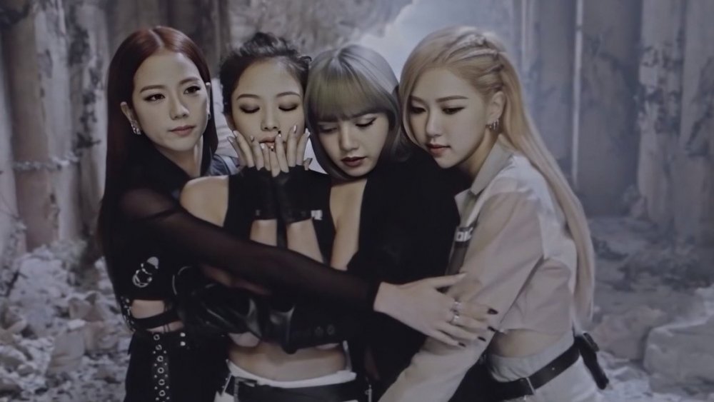 BLACKPINK hugging on a music video set