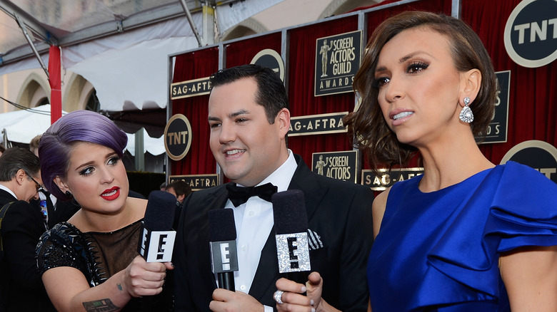 Giuliana Rancic and Kelly Osbourne presenting at the SAG awards with a male co-host