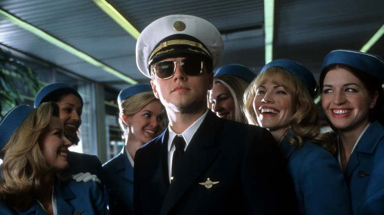 Leonardo DiCaprio as a pilot surrounded by women in "Catch Me if You Can"