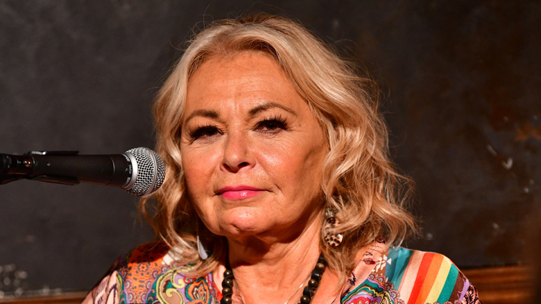 Roseanne Barr with a microphone in 2018