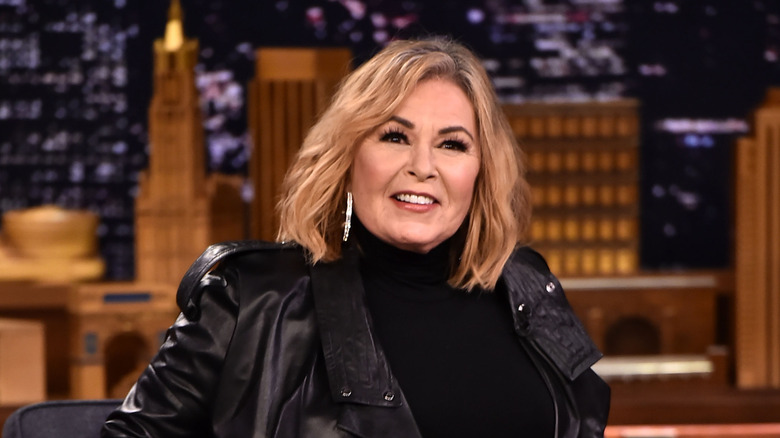 Roseanne Barr in black on Jimmy Fallon's talk show