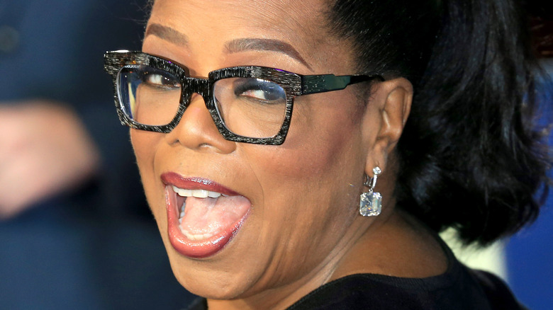 Oprah Winfrey smiling at a movie premiere