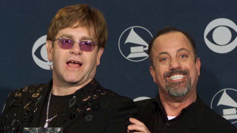 Elton John and Billy Joel posing