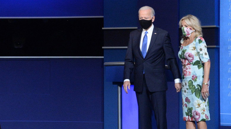 President Biden and Dr. Jill Biden holding hands