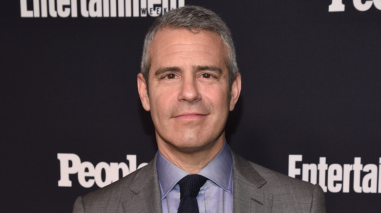 Andy Cohen smirking