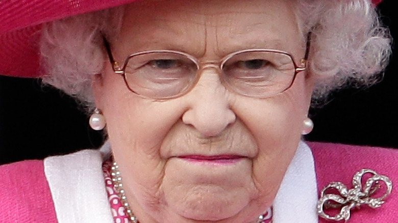 Queen Elizabeth at event frowning