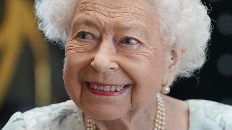 Queen Elizabeth smiling with pearl earring