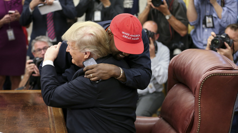 Kanye West and Donald Trump hugging