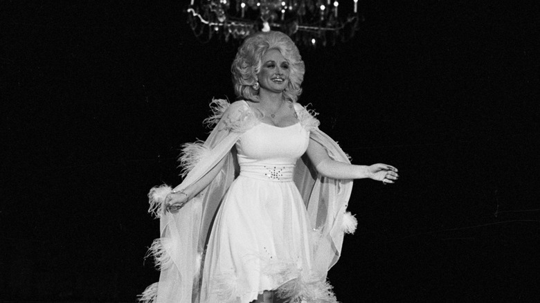 Dolly Parton in a white dress onstage at the Rock Awards