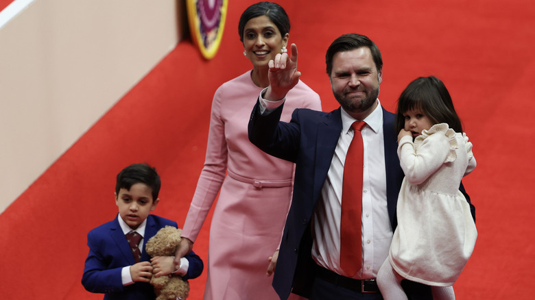 JD and Usha Vance walk into the inauguration parade with their children.