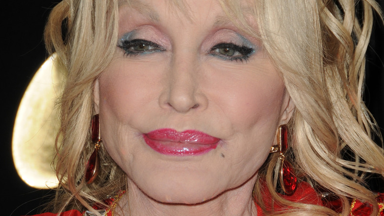 Dolly Parton poses at an event