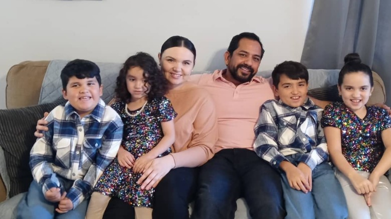 David and Chrisanta Delao posing for cameras with their young family