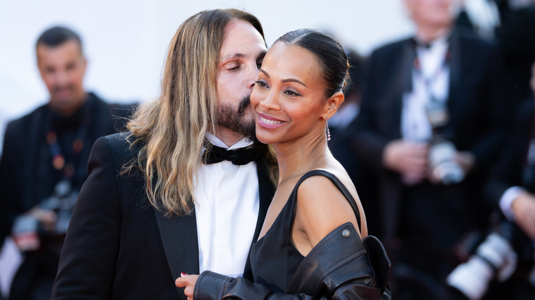 Marco Saldana kissing Zoe Saldana on the cheek at Cannes in 2025.
