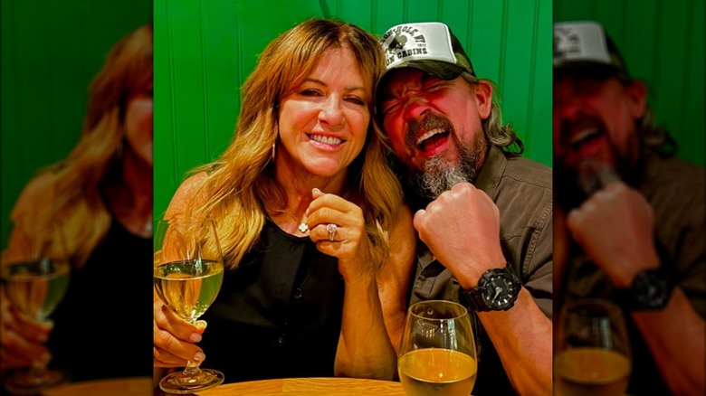 James Jordan and Debra Schrey pose together in a restaurant.