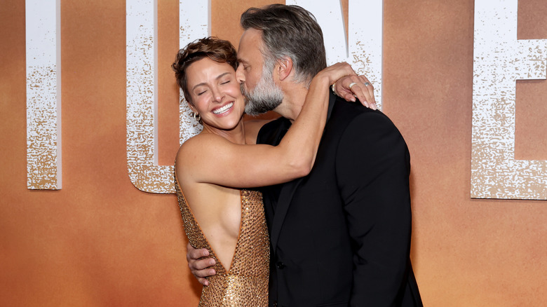 David Lemanowicz kissing Jill Wagner on the cheek at the "Lioness" premiere.