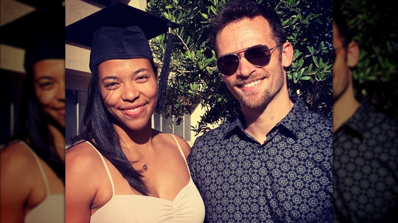 Taryn Bailey Wharton and Jonah Wharton pose together at her masters graduation.